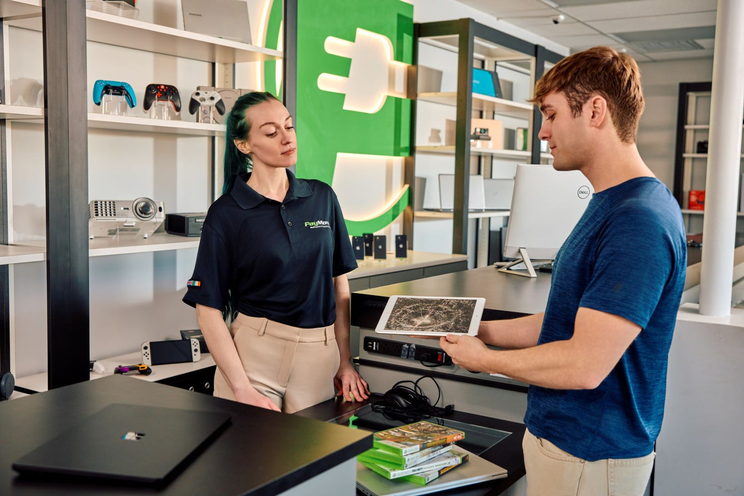 paymore employee inspecting electronics