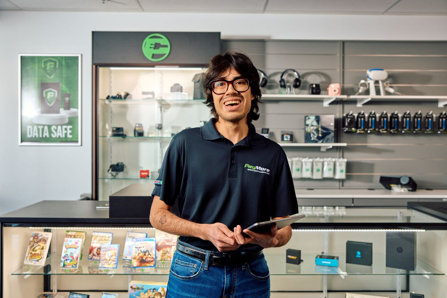 paymore employee holding a tablet and smiling